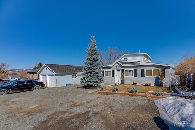 view of front of home featuring fence