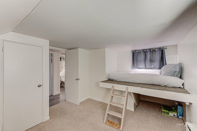 bedroom featuring a baseboard radiator and baseboards