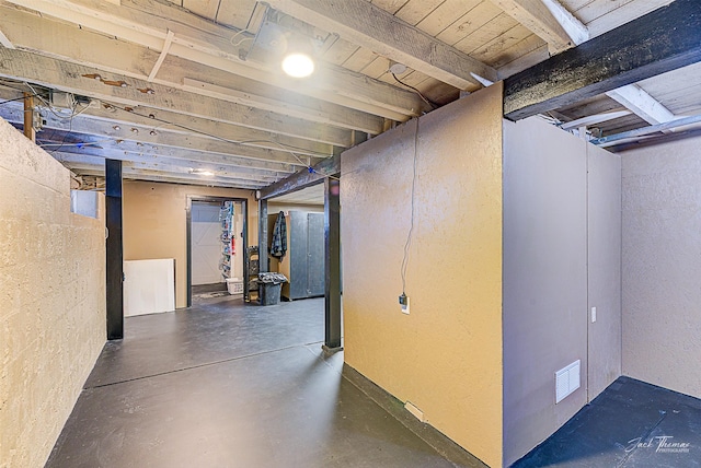 unfinished basement featuring visible vents