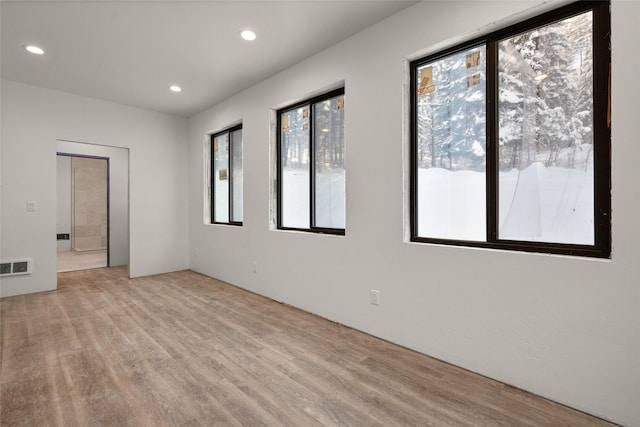 unfurnished room with light hardwood / wood-style floors