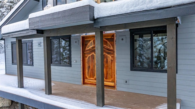 view of snow covered deck