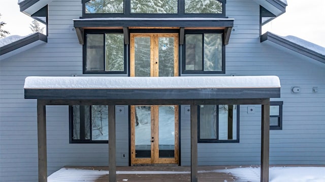 exterior space with a deck and french doors