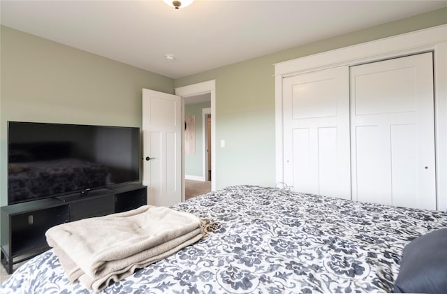 carpeted bedroom with a closet