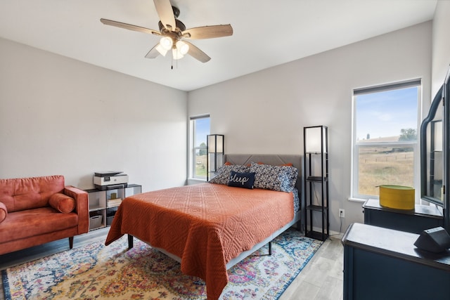 bedroom featuring ceiling fan and light wood-type flooring