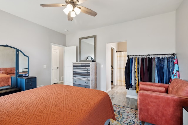 bedroom with ceiling fan and light wood-type flooring