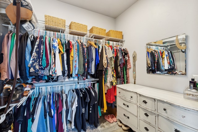 walk in closet featuring light hardwood / wood-style floors