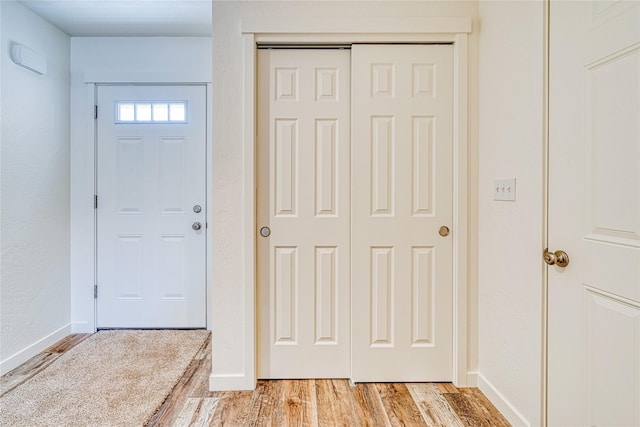 foyer entrance with light wood-type flooring