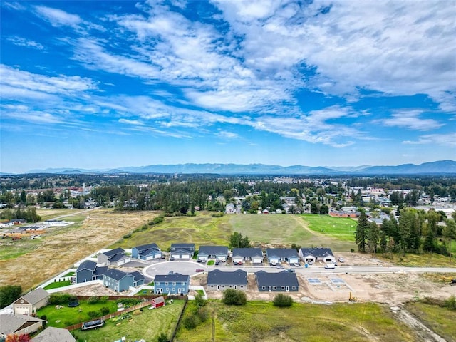 birds eye view of property featuring a mountain view