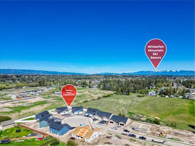 birds eye view of property featuring a mountain view