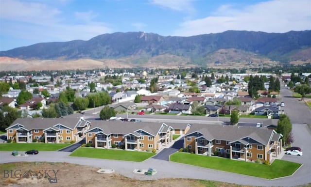 birds eye view of property with a mountain view