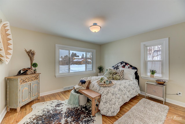 bedroom with light hardwood / wood-style floors