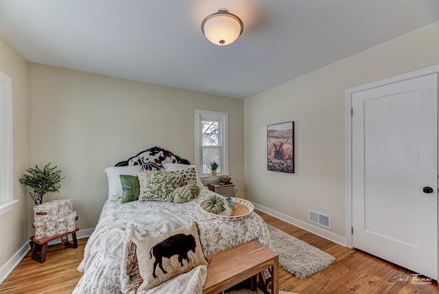 bedroom featuring light wood-type flooring