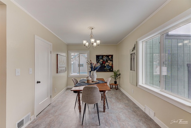 dining space with crown molding and a notable chandelier