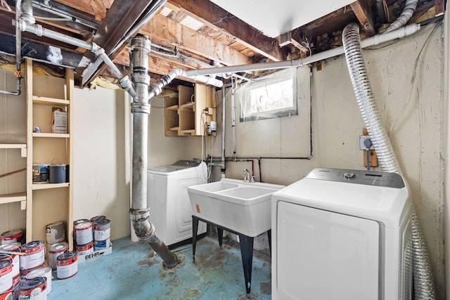 laundry area featuring sink and washing machine and clothes dryer