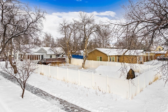 view of yard layered in snow