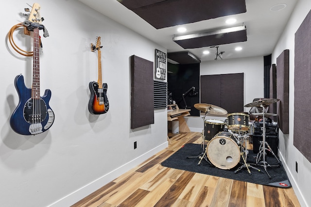 bathroom with hardwood / wood-style floors