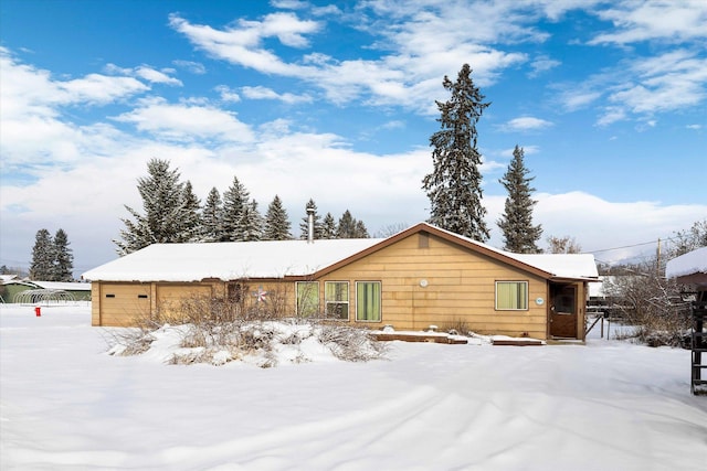 view of snow covered house