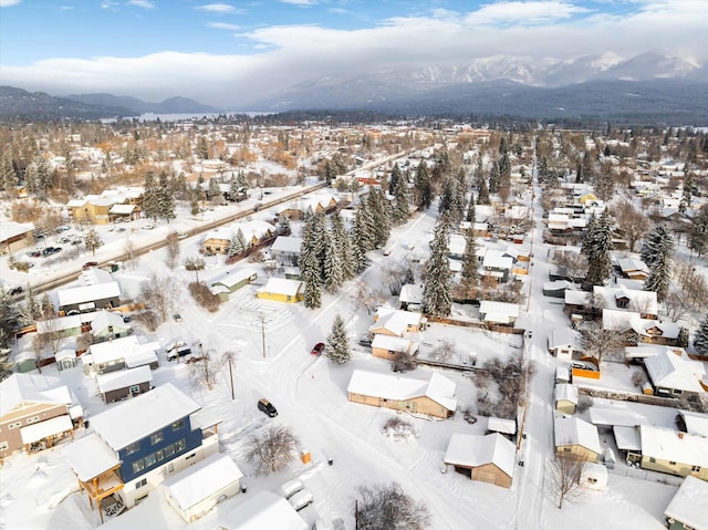 snowy aerial view with a mountain view