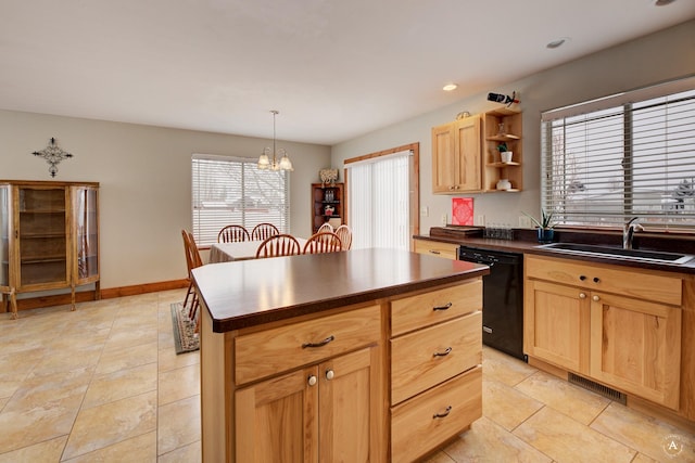 kitchen with a kitchen island, black dishwasher, sink, hanging light fixtures, and an inviting chandelier