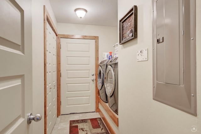 clothes washing area featuring washer and dryer and electric panel