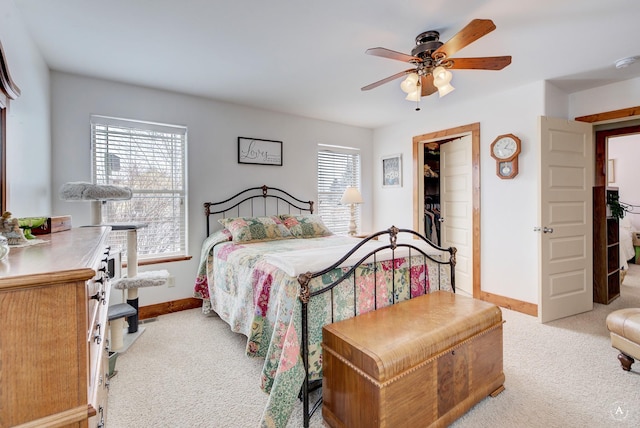 bedroom featuring light carpet and ceiling fan