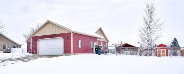 view of snow covered garage