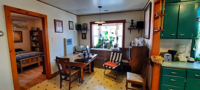 dining space featuring crown molding and light wood-type flooring