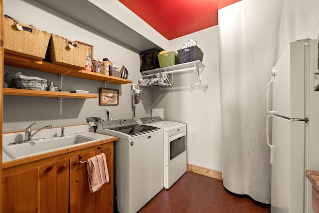 laundry area featuring sink and washing machine and clothes dryer