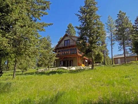 back of house featuring a wooden deck