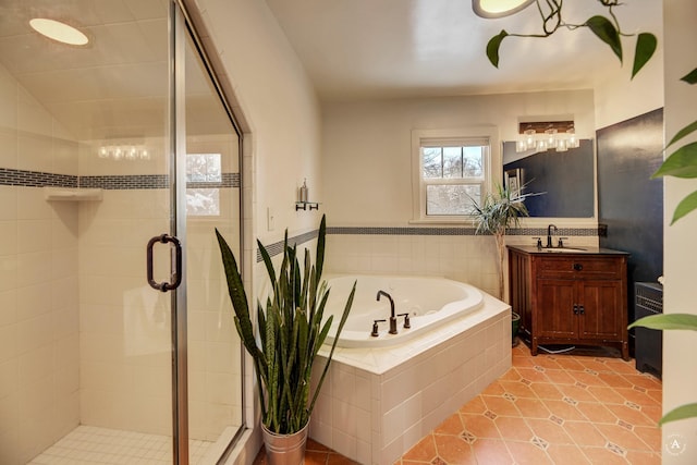 bathroom featuring tile patterned floors, plus walk in shower, and vanity