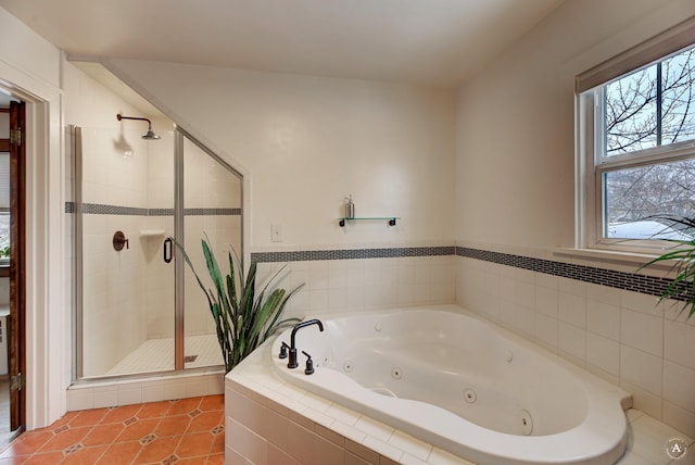 bathroom with tile patterned flooring and independent shower and bath