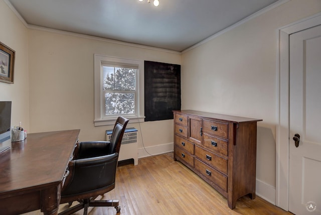 office area with ornamental molding and light hardwood / wood-style flooring