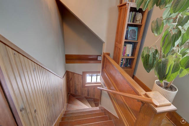 stairway with wood walls