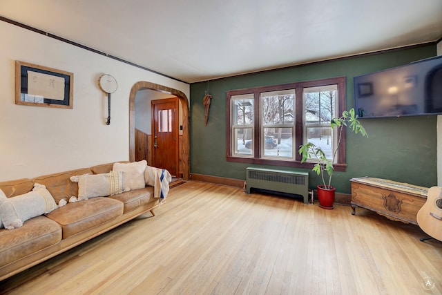 living room featuring light hardwood / wood-style flooring and radiator heating unit