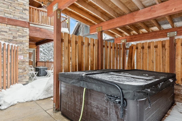 view of patio / terrace with a hot tub