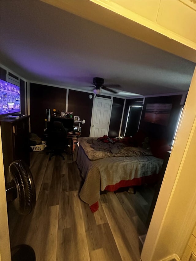 bedroom with wood-type flooring