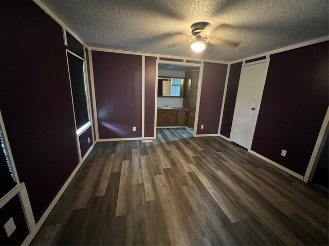 bathroom featuring a shower with curtain, vanity, a textured ceiling, and toilet