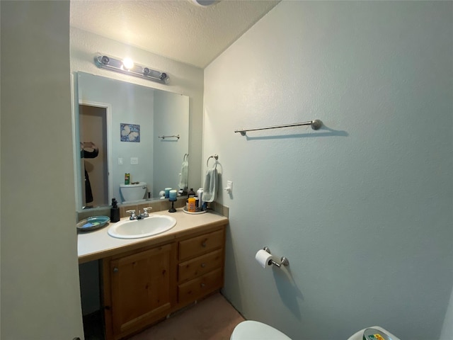 bathroom with vanity and a textured ceiling