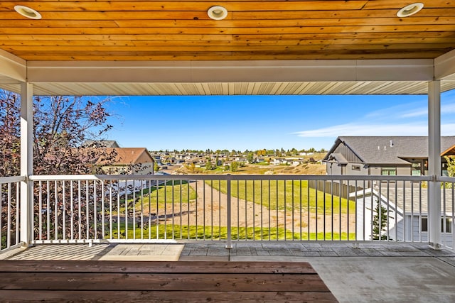 wooden terrace featuring a residential view