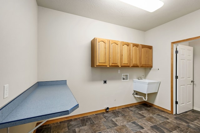 laundry room with washer hookup, cabinet space, hookup for an electric dryer, gas dryer hookup, and baseboards