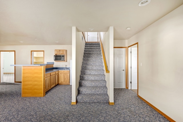 stairs with carpet flooring and baseboards