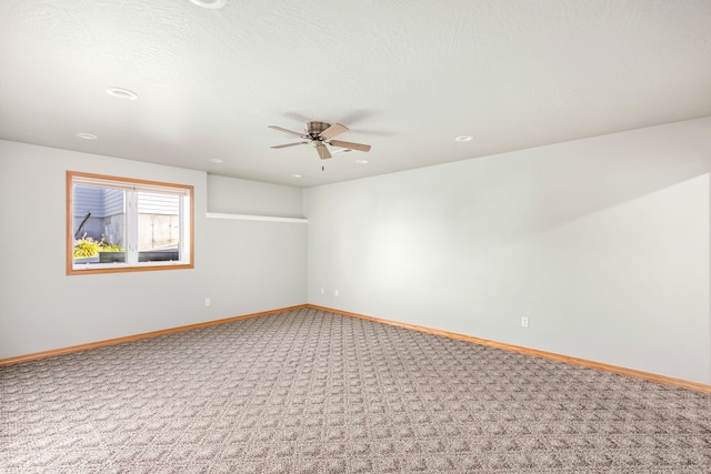 carpeted spare room with recessed lighting, ceiling fan, a textured ceiling, and baseboards