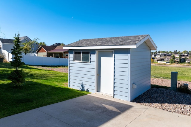 view of shed with fence