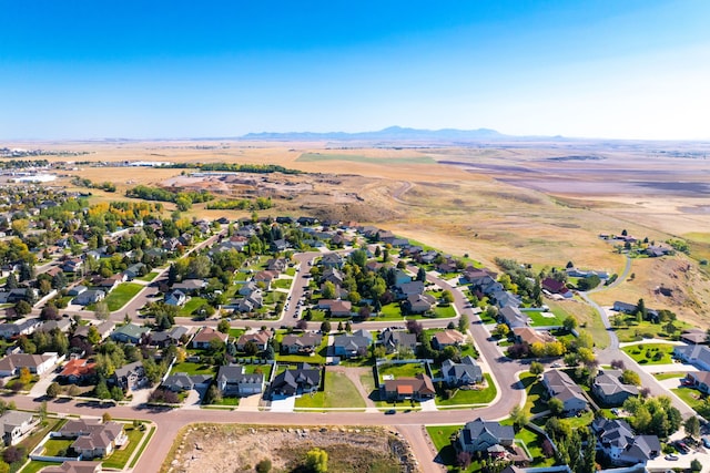 drone / aerial view with a residential view and a mountain view