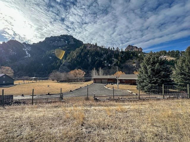 mountain view featuring a rural view