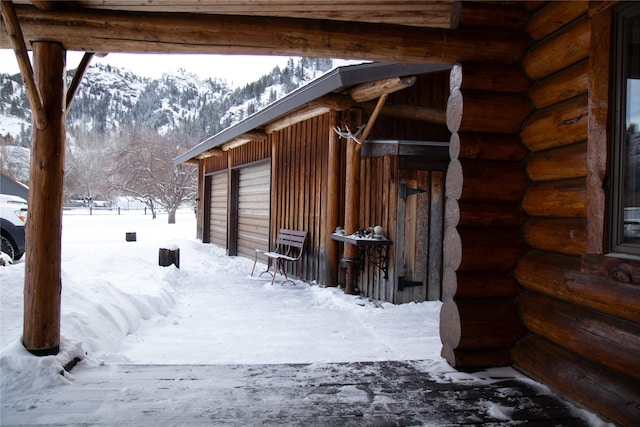 snow covered property with a mountain view