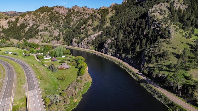 68 River Dr, Cascade, MT 59421 - aerial overview of property's location featuring a water and mountain view, a heavily wooded area, and a main thoroughfare