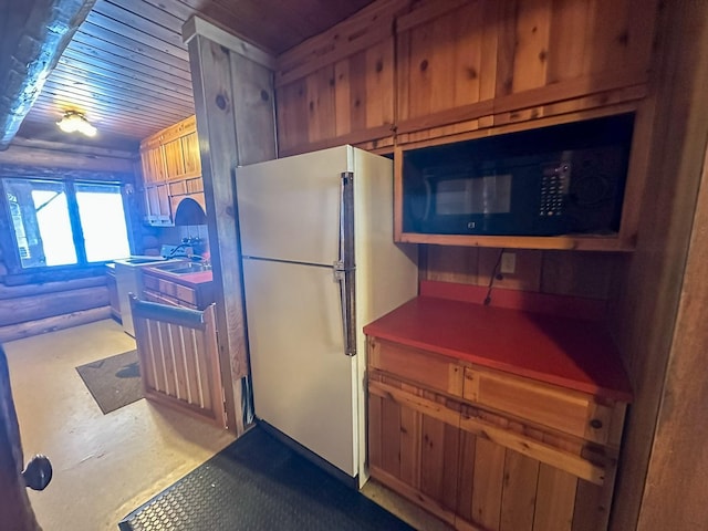 68 River Dr, Cascade, MT 59421 - kitchen with freestanding refrigerator, wooden ceiling, and black microwave
