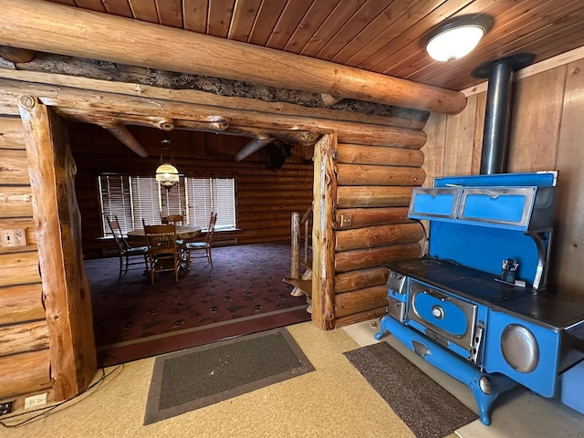 68 River Dr, Cascade, MT 59421 - interior space featuring log walls, wood ceiling, and a wood stove