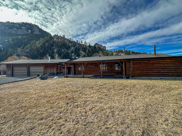 view of front of home featuring a mountain view and a porch